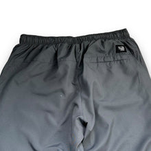 Load image into Gallery viewer, Nike 2000’s baggy cuffed track bottoms (L)
