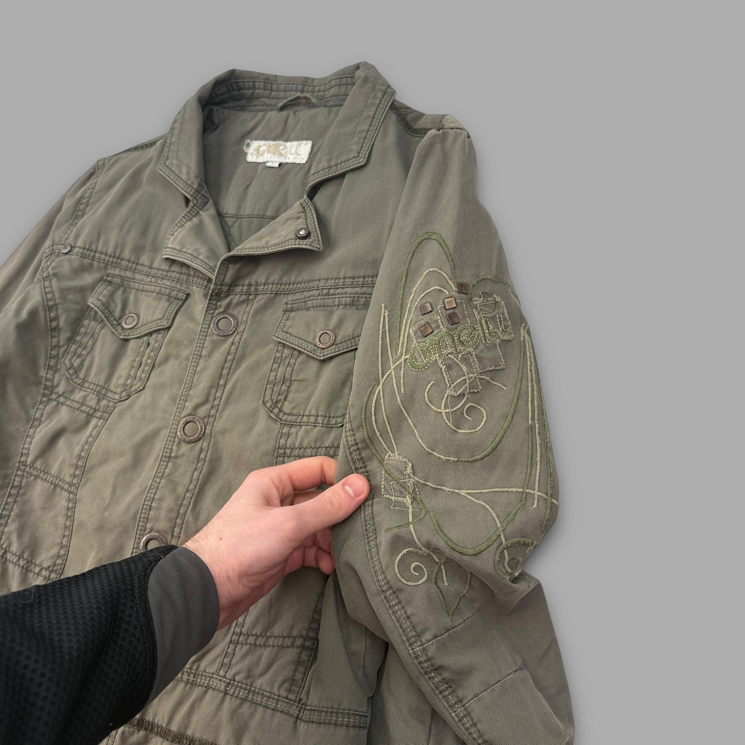 O'Neill 2000's multi-pocketed, pop button, embroidered utility jacket (L) wms