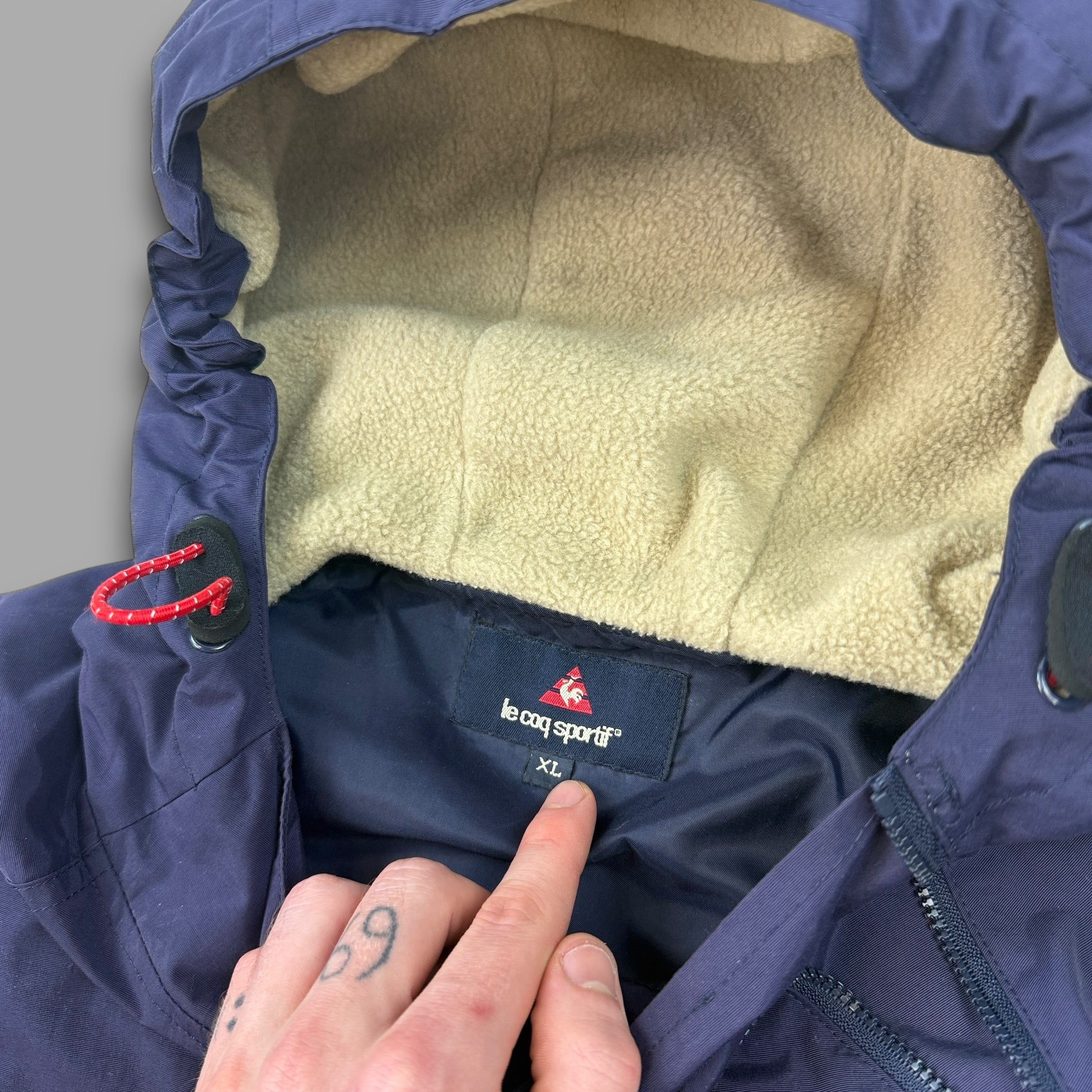 Le coq sportif 2000's technical asymmetrical zip pullover windbreaker (XL)