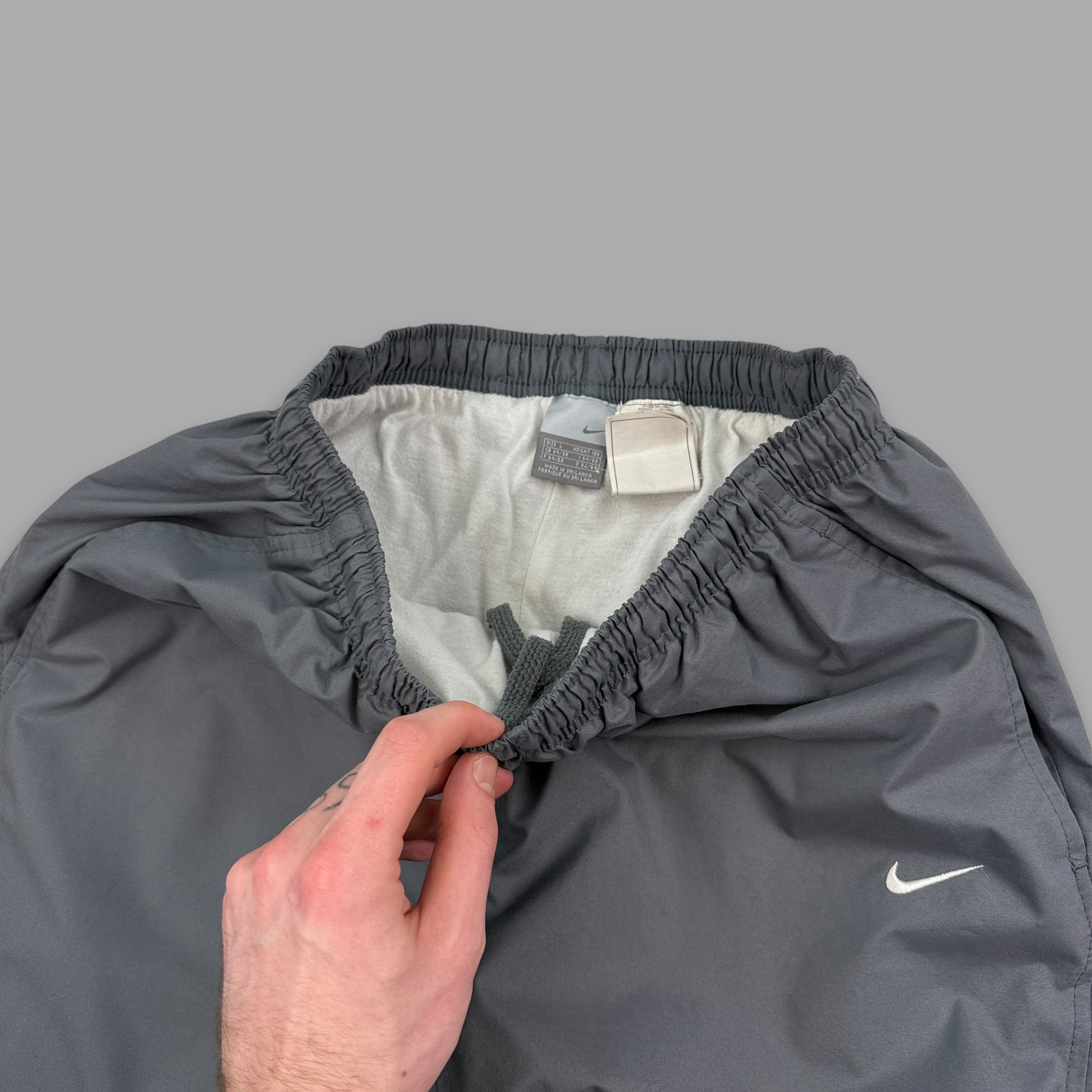 Nike 2000's baggy panelled uncuffed track bottoms (L)