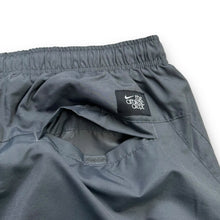 Load image into Gallery viewer, Nike 2000’s baggy cuffed track bottoms (L)
