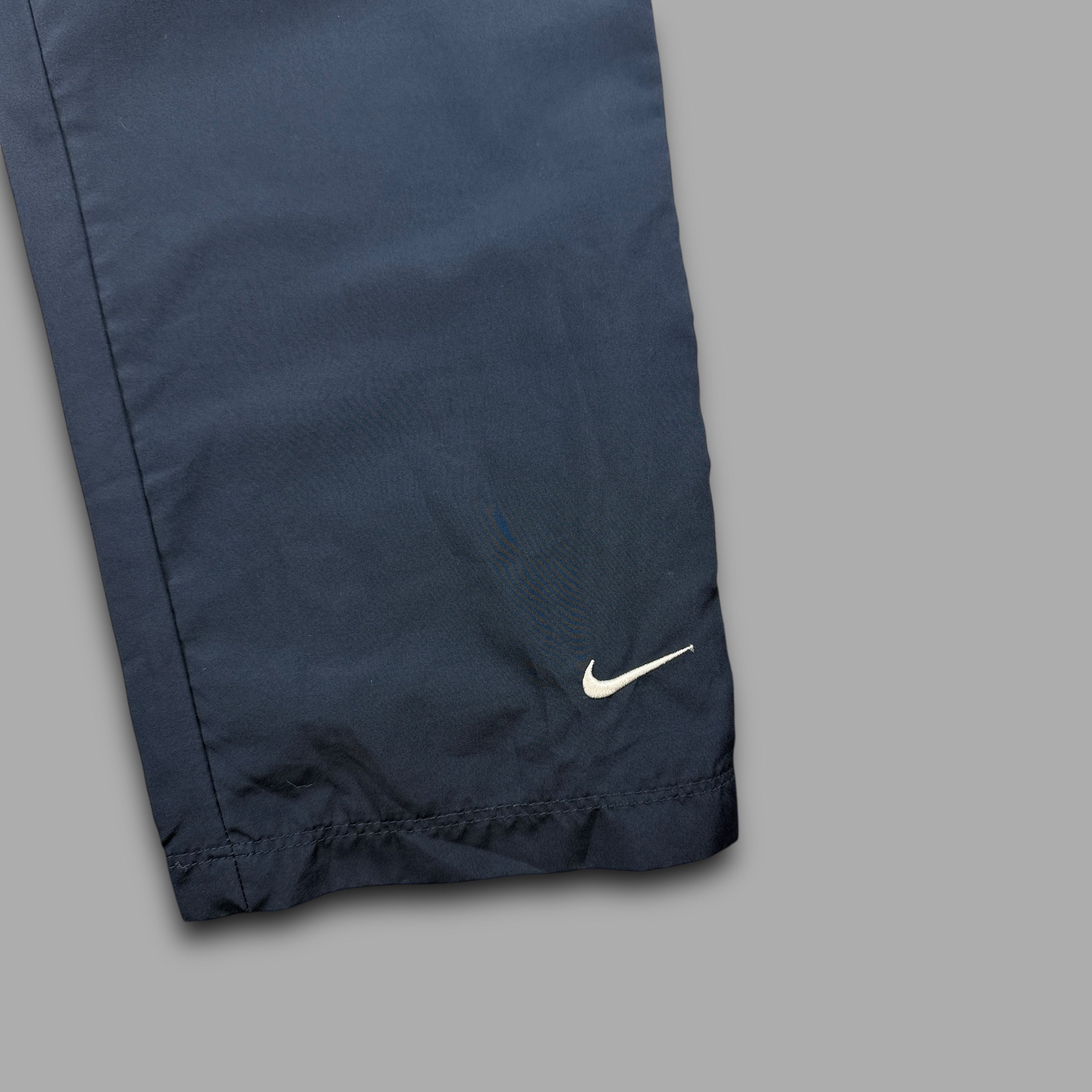 Nike 2000's baggy reflective nylon track bottoms (M)