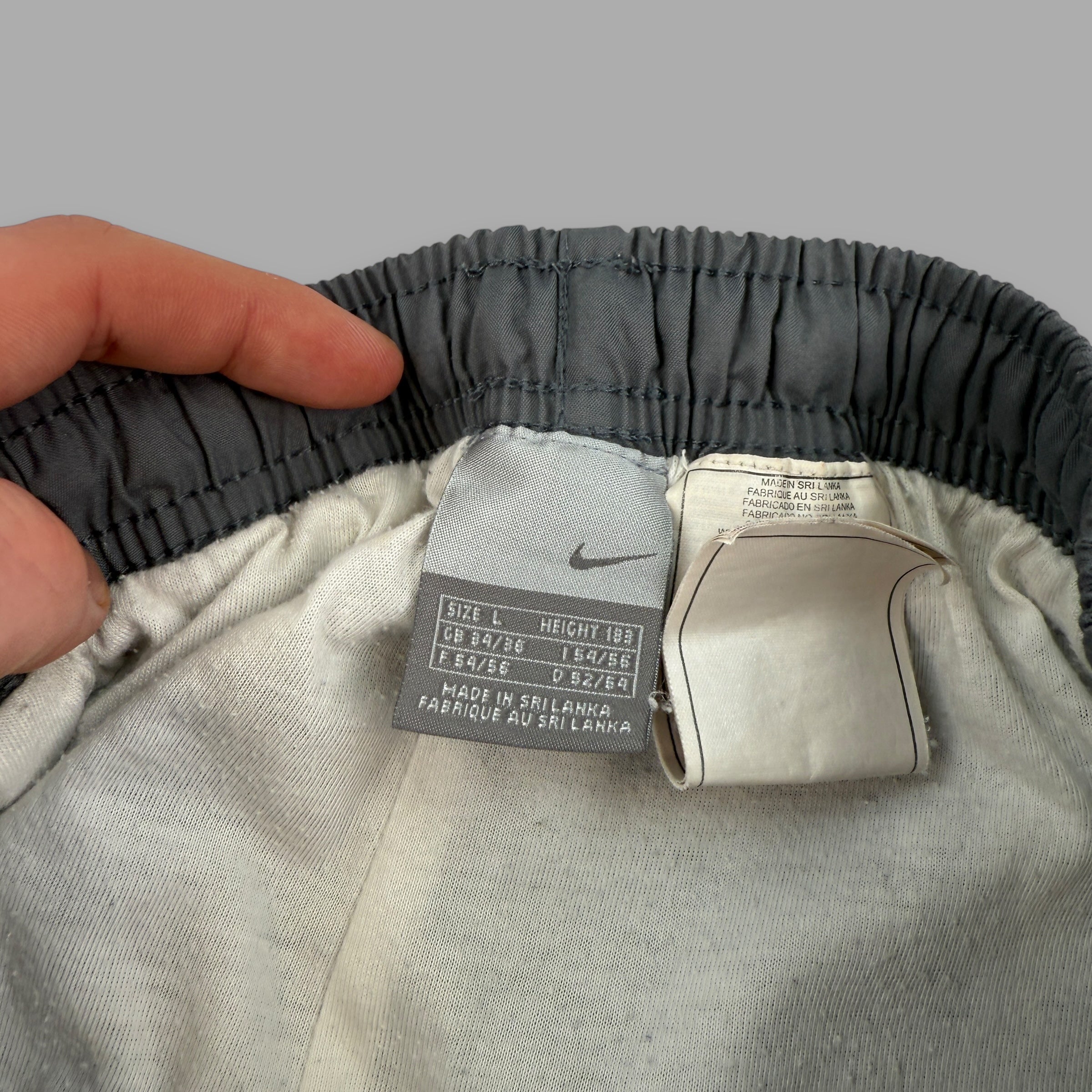 Nike 2000's baggy panelled uncuffed track bottoms (L)