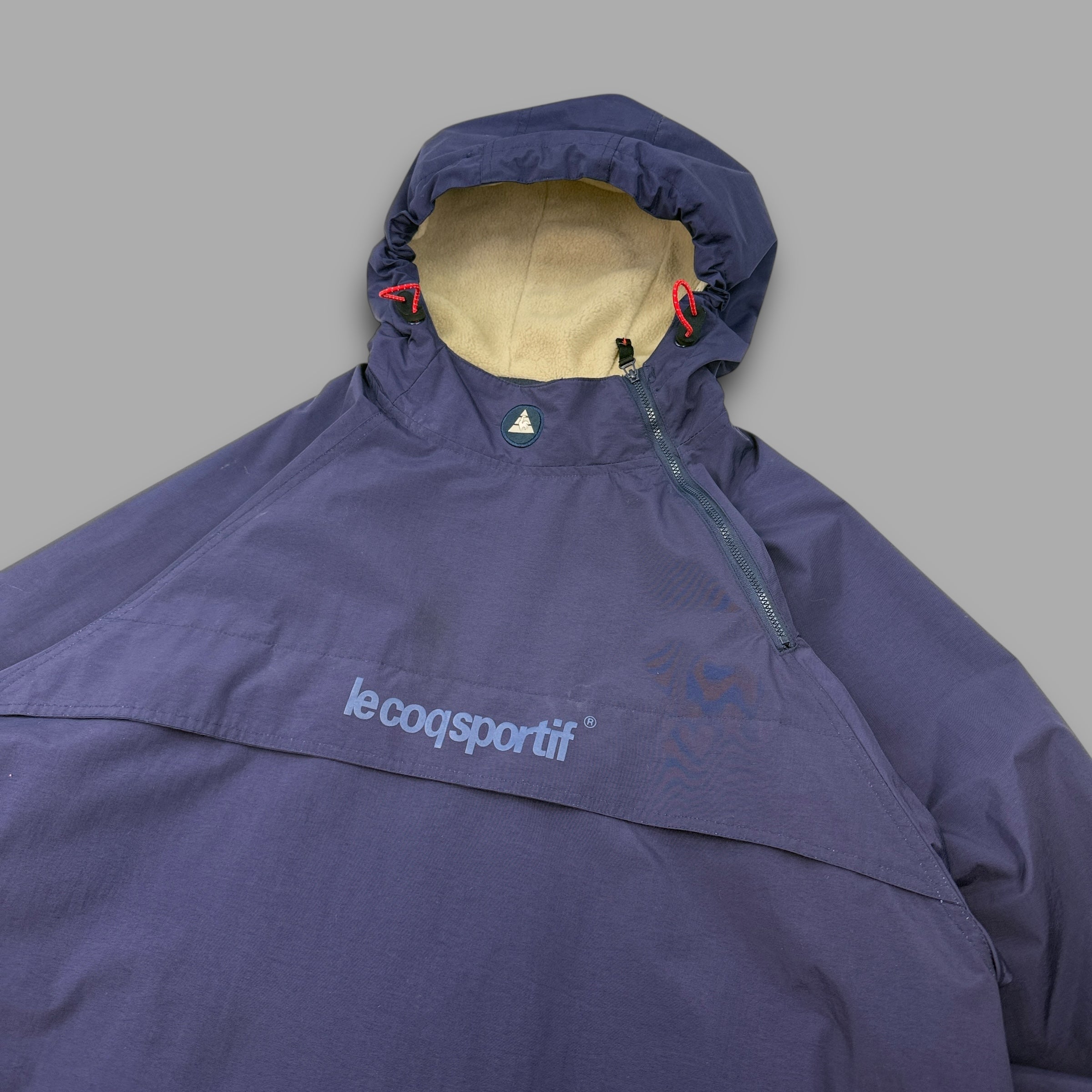 Le coq sportif 2000's technical asymmetrical zip pullover windbreaker (XL)
