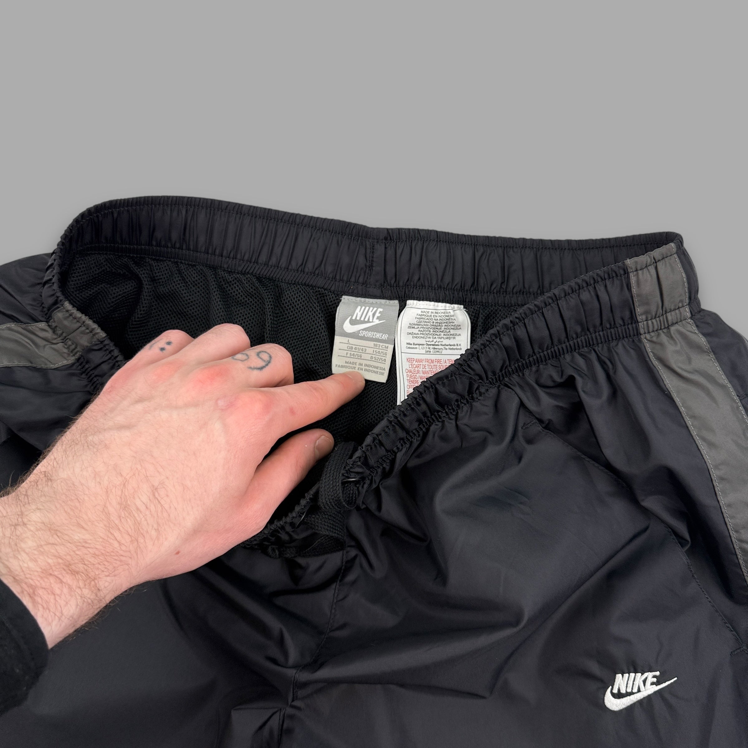 Nike 2000's baggy nylon popper track bottoms (L)
