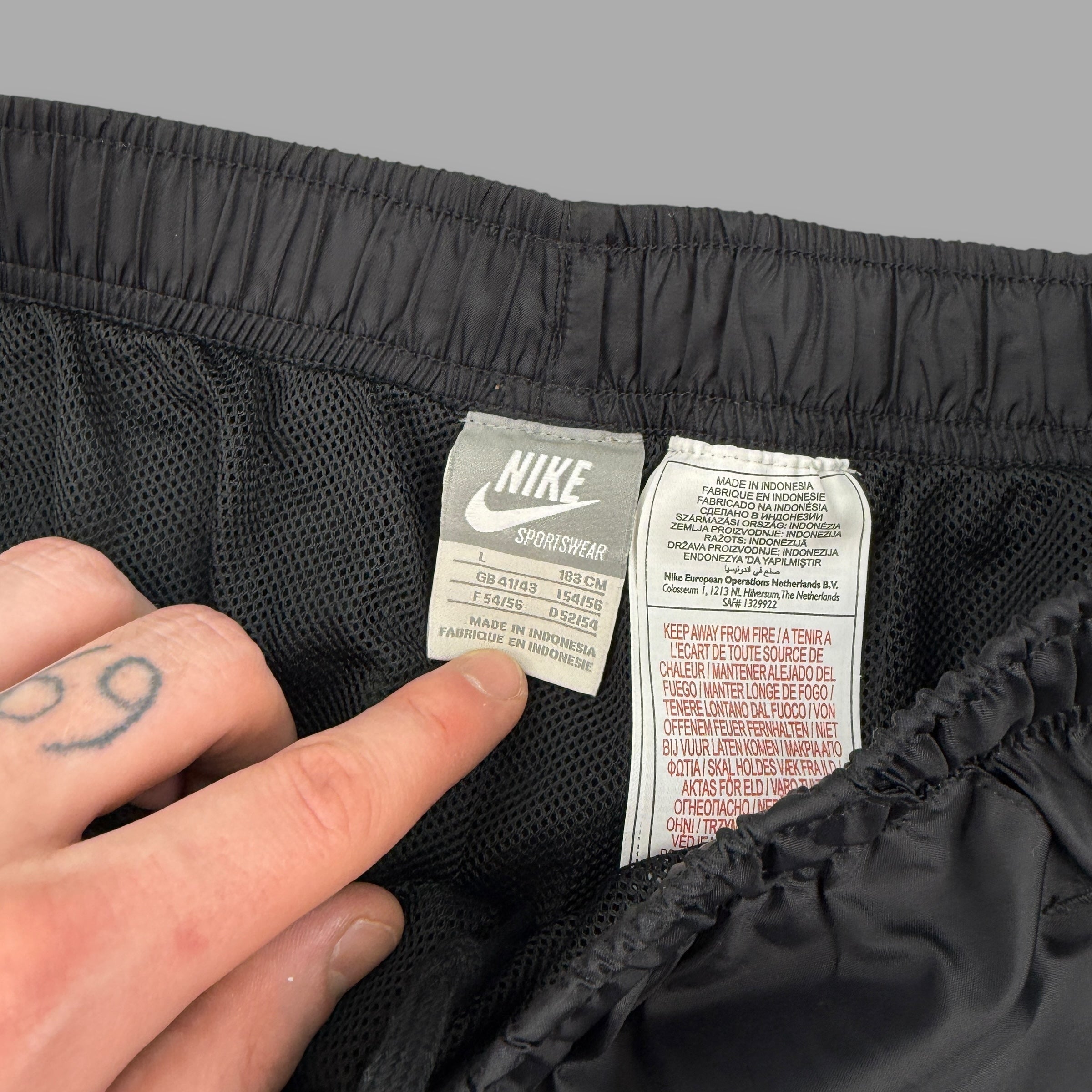 Nike 2000's baggy nylon popper track bottoms (L)