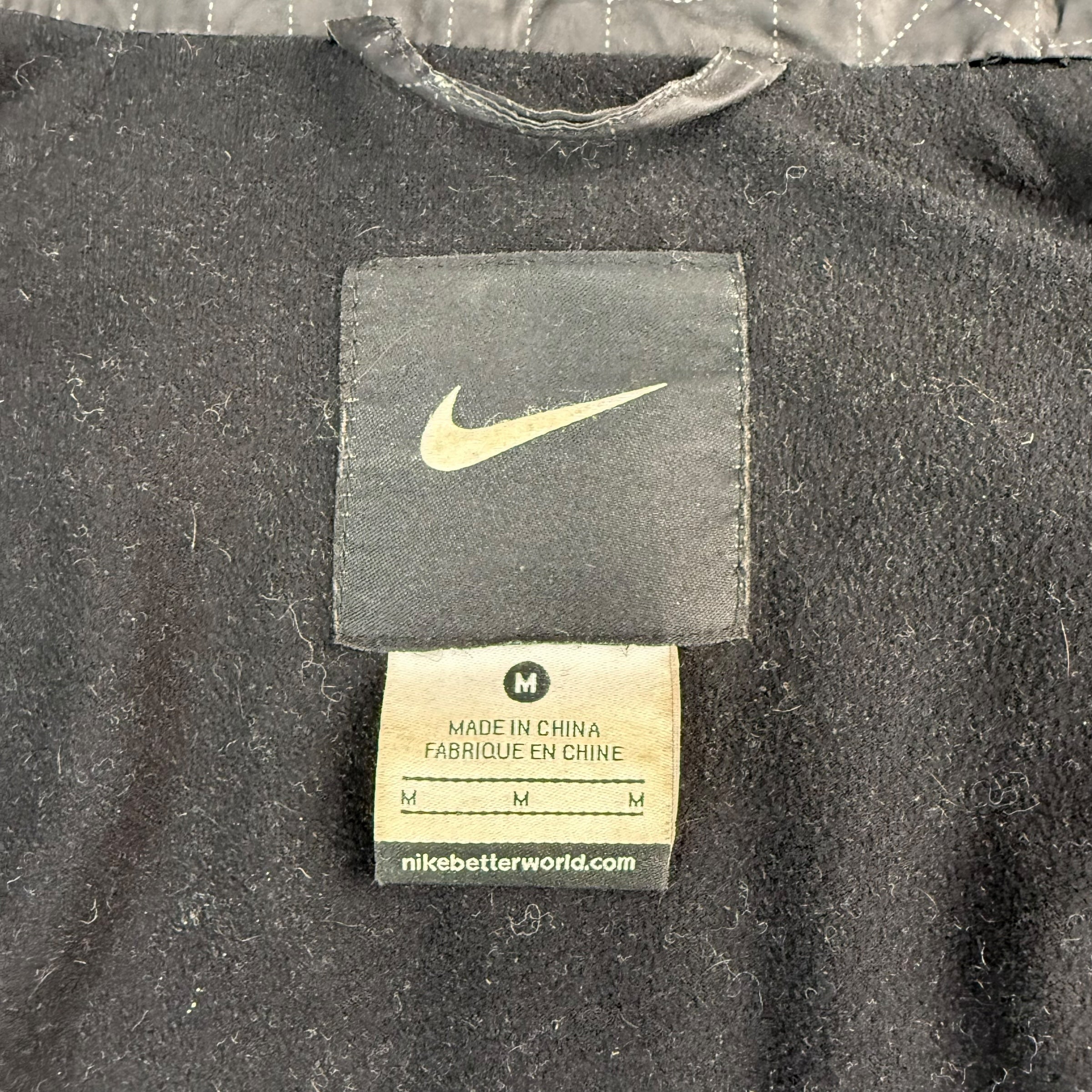 Nike 2000's technical articulated monogram puffer jacket (M)