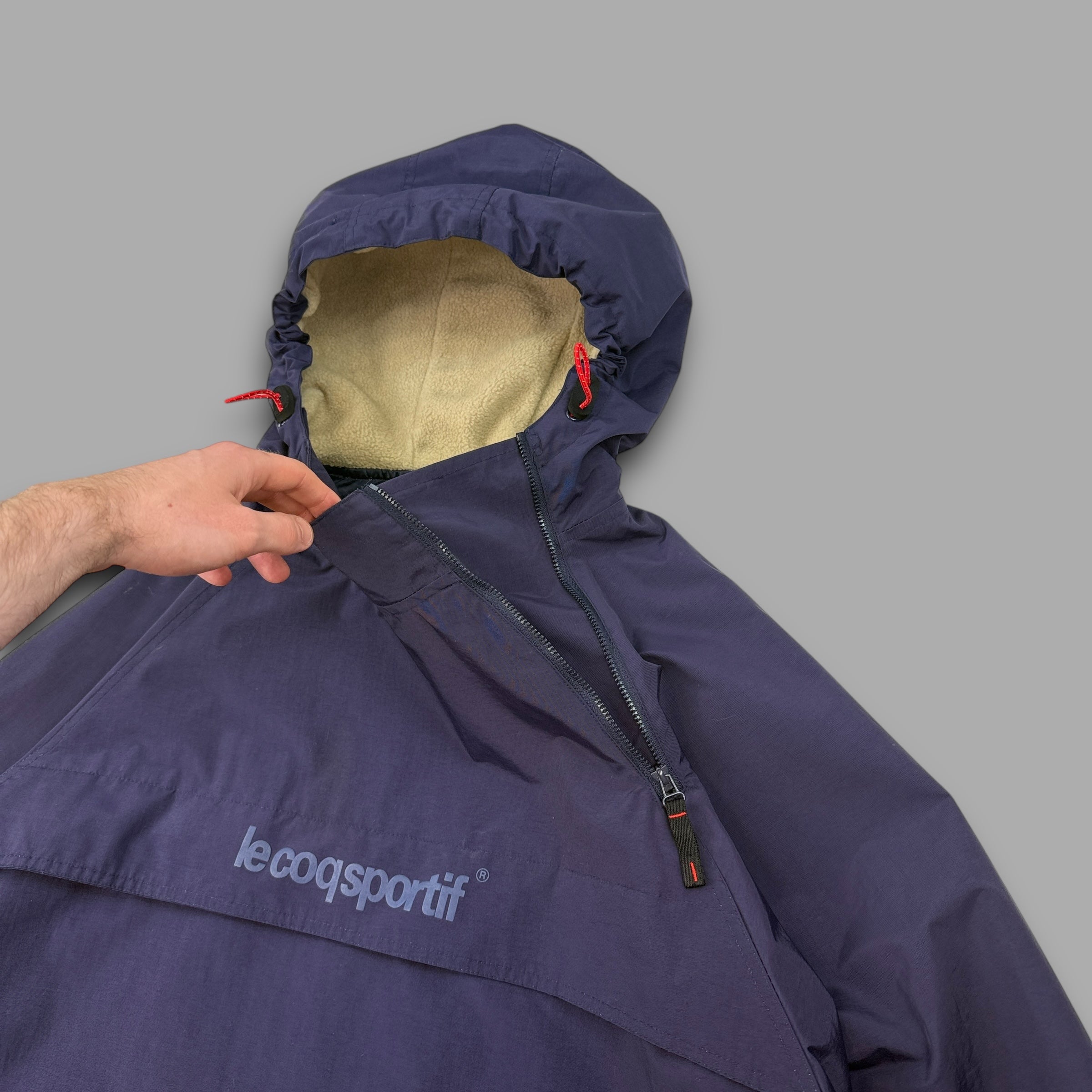 Le coq sportif 2000's technical asymmetrical zip pullover windbreaker (XL)